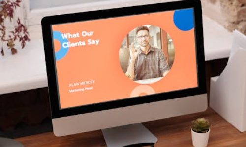 Stylish home office setup with computer showcasing client testimonials.